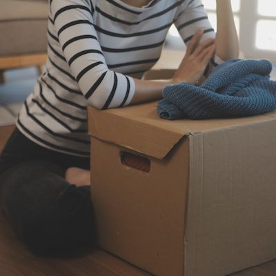 Woman Unpacking Boxes